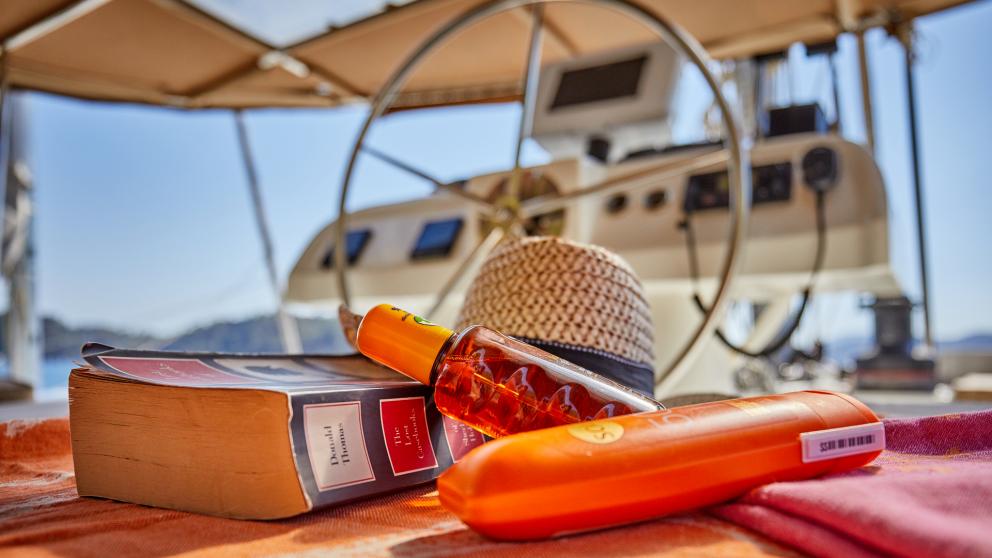 Favorite books and sunscreen on board the catamaran