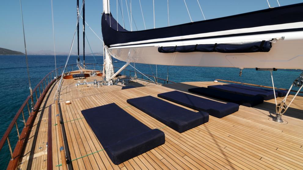 The bow deck of the Clear Eyes gulet. You can see the blue sunbeds