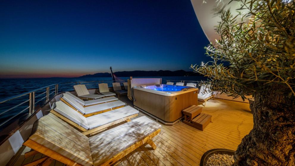 The sunbathing area and Jacuzzi on the flybridge of the luxury motor yacht Olimp image 2