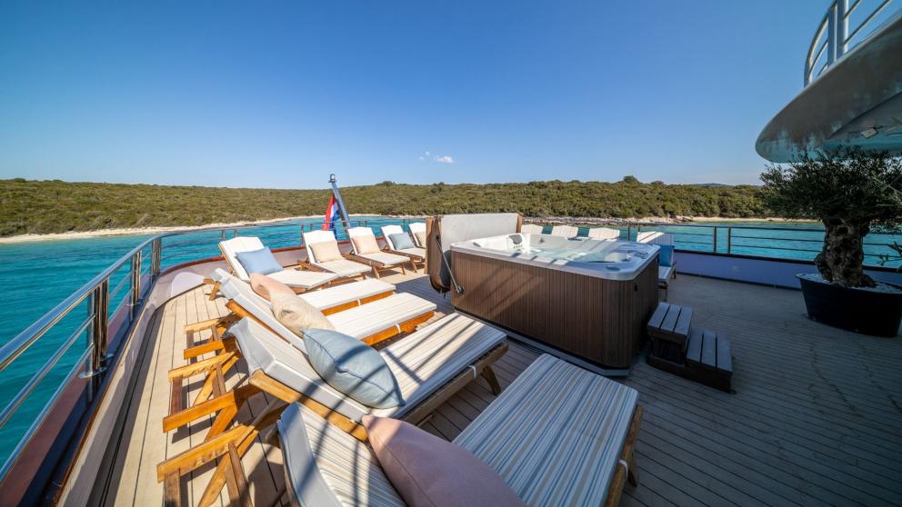 The sunbathing area and Jacuzzi on the flybridge of the luxury motor yacht Olimp image 1