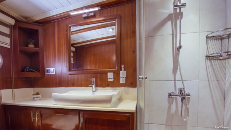 Bathroom on the gulet. You can see the sink with mirror and shower