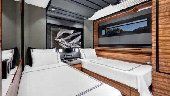 The twin cabin of the luxury motor yacht, wood and gray tones are standing out.