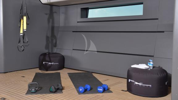 Gym and some sports equipment inside the motor yacht.
